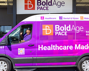 employee waving from the transportation van